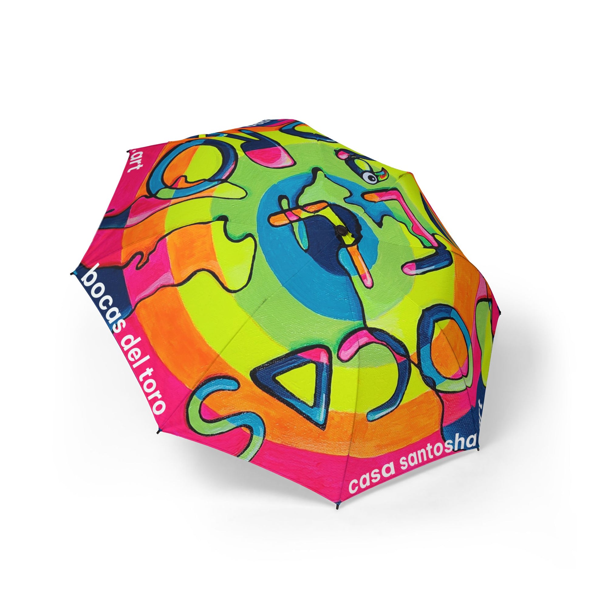 Colorful umbrella with abstract designs and branding on a white background