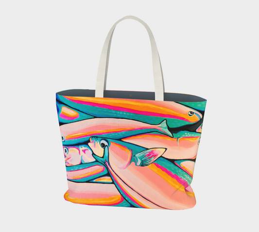 A tote bag with a colorful print of stacked fish in pink, orange, teal, and yellow, featuring light gray fabric shoulder straps, shown against a plain light gray background.